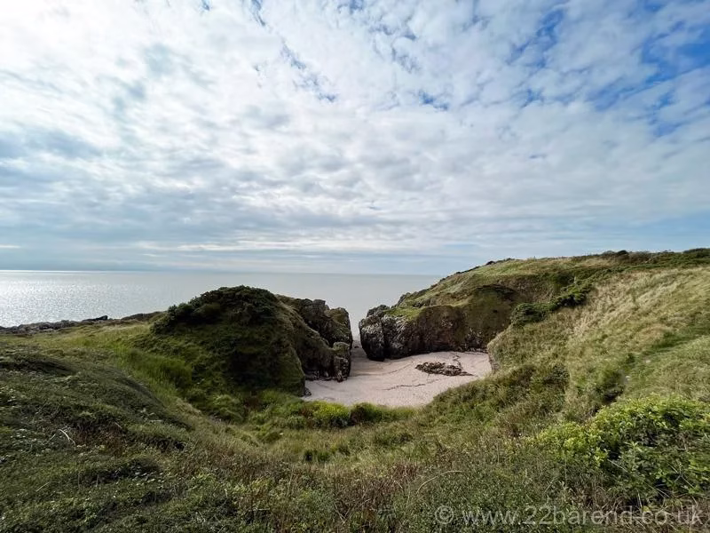 A small beach with a narrow sea inlet on the Solway coast