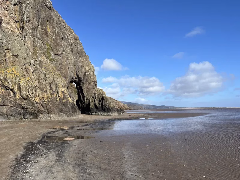 The Needle's Eye natural rock arch near Sandyhills Beach on the Solway Coast, accessible at low tide