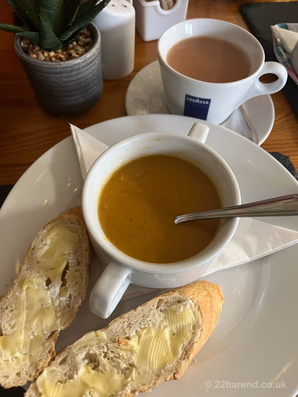 A bowl of homemade sweet potato, coconut and chilli soup and crusty bread at Cafe Rendezvous in Wigtown.